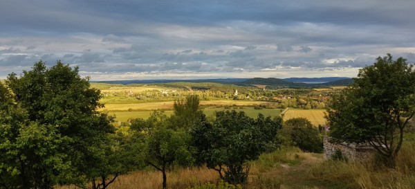 Sunshine breaks through the clouds, panorama of Pécsely